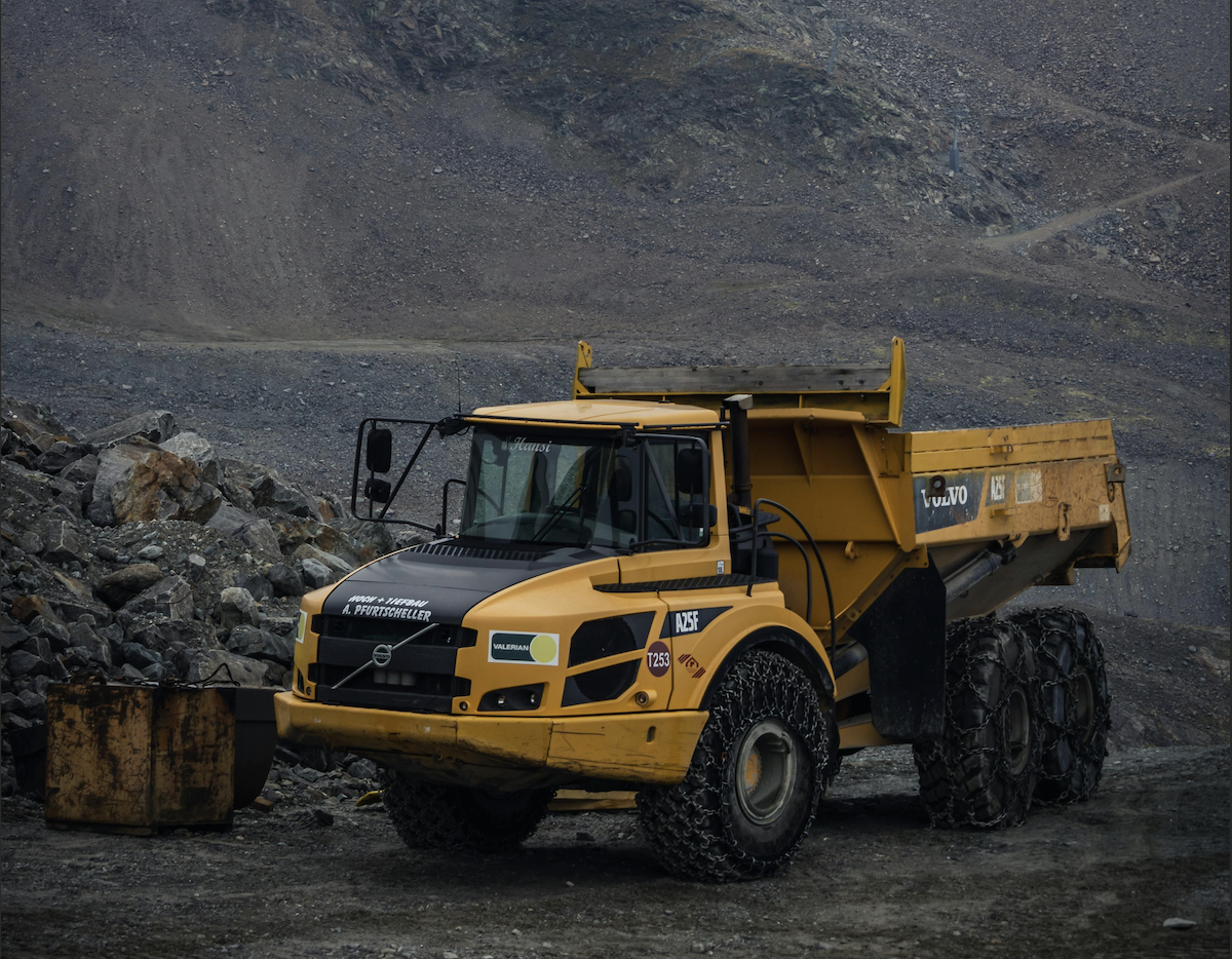 Operator driving rear dump truck during NPORS N205 training at construction site