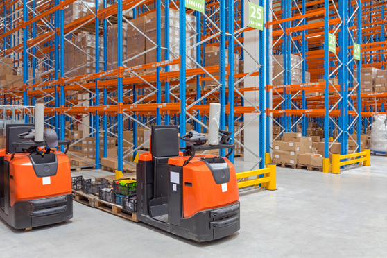 Trainee operating pivot steer forklift in warehouse during NPORS N013 course