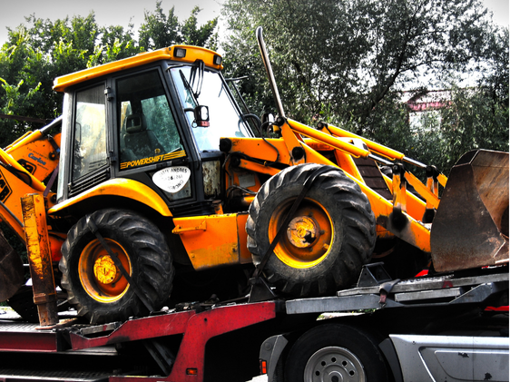 Operator using plant loader to load materials safely during NPORS N120 training