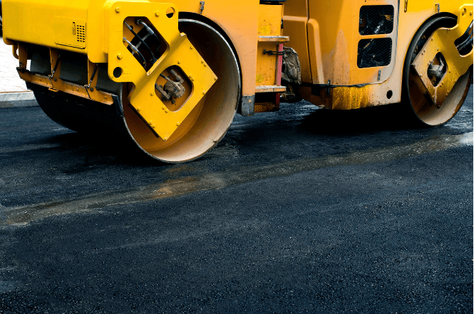 Close-up of road roller compacting asphalt during NPORS N214 training