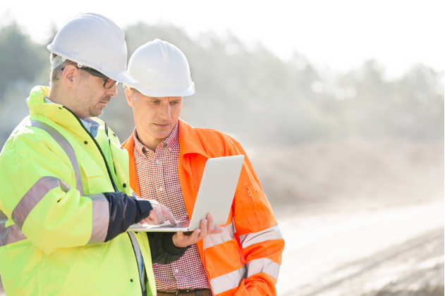 Appointed person planning lifting operations during NVQ Level 5 training on a UK construction site