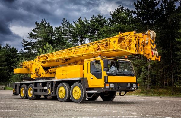 Mobile crane operator performing blocked duties during CPCS A60A training on a controlled construction site