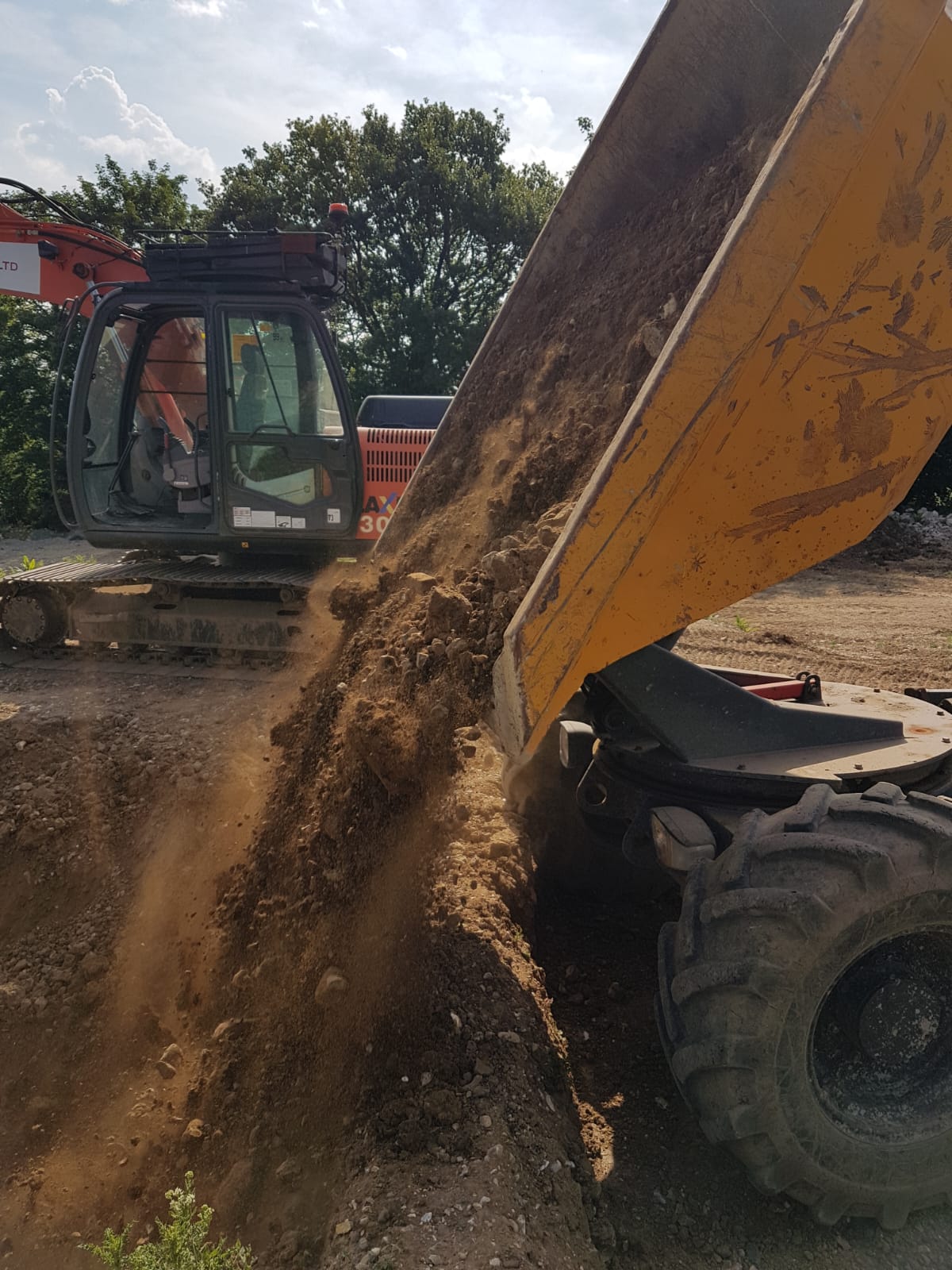 Wheeled forward tipping dumper in use during CPCS A09 training on a UK construction site