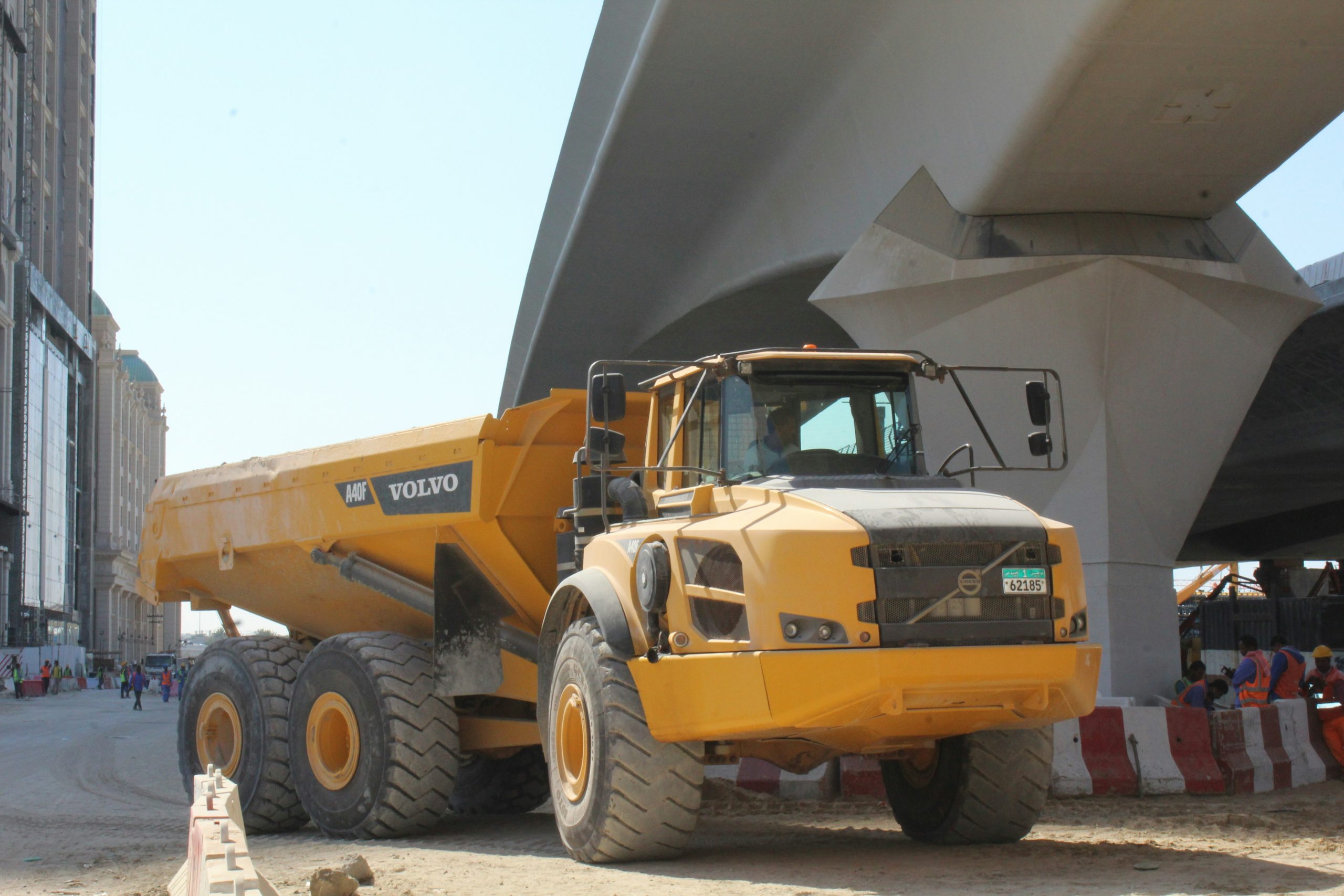 Articulated dumper truck transporting materials on a UK training site as part of CPCS A56 course