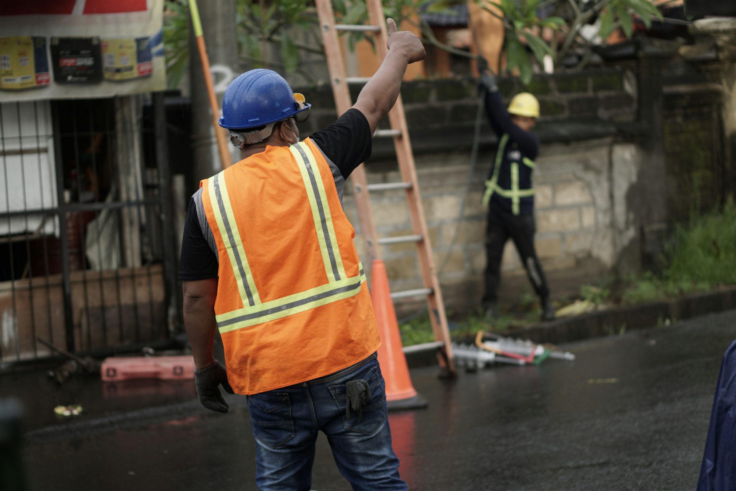 Worker placing safety barriers during NPORS N714 Street & Road Works training