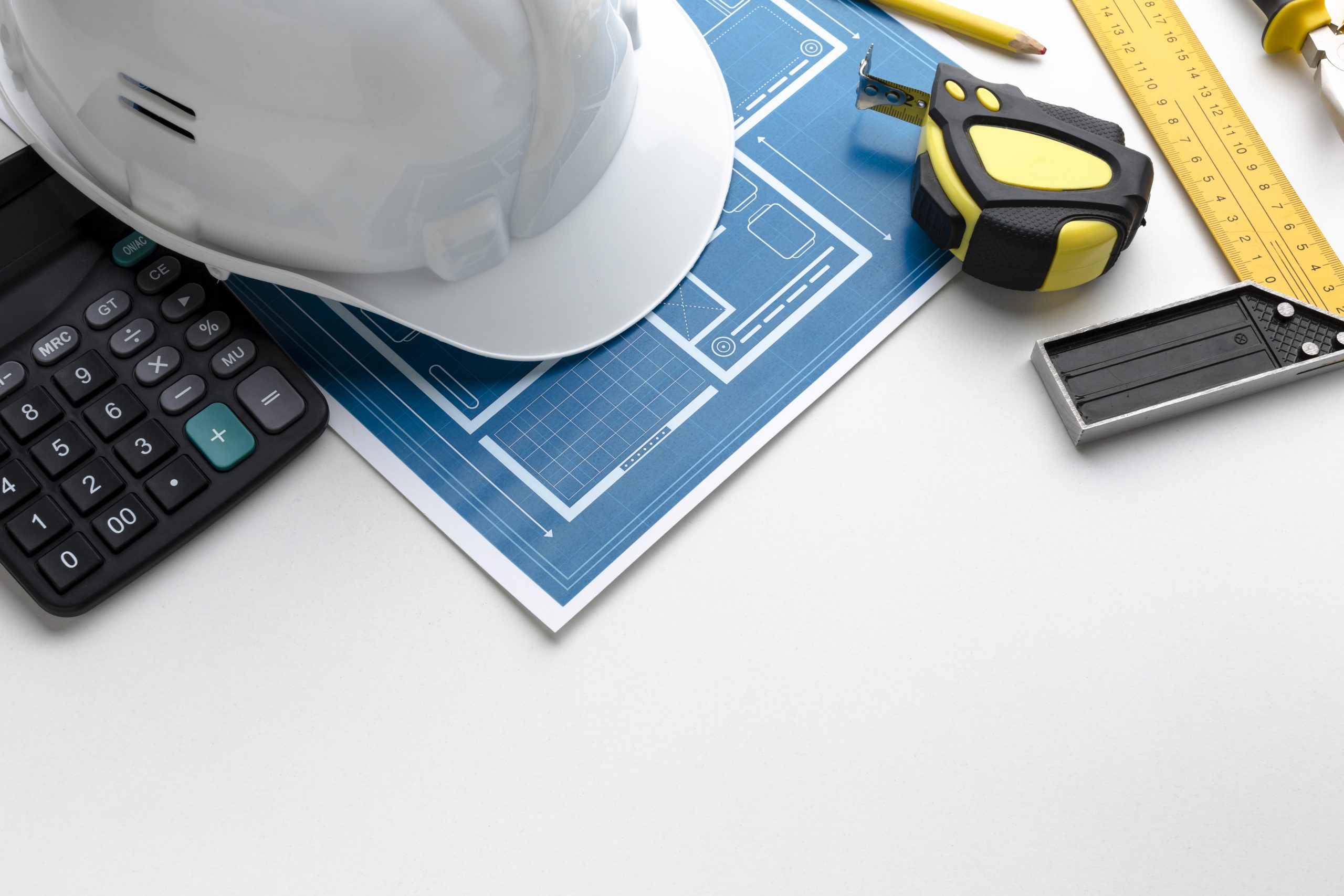 Construction planner reviewing site plans and schedules during NVQ Level 6 training