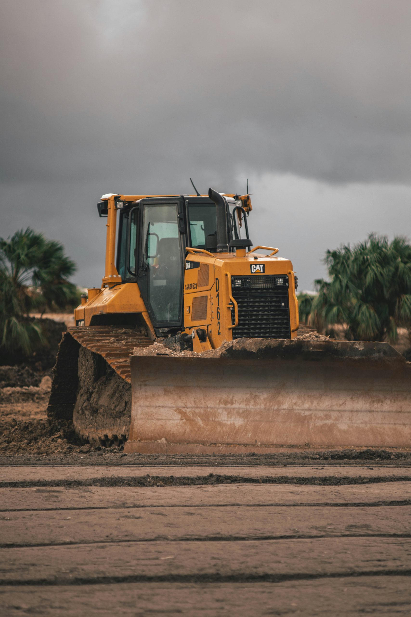Skilled operator manoeuvring a CPCS A34 dozer on a construction site during training