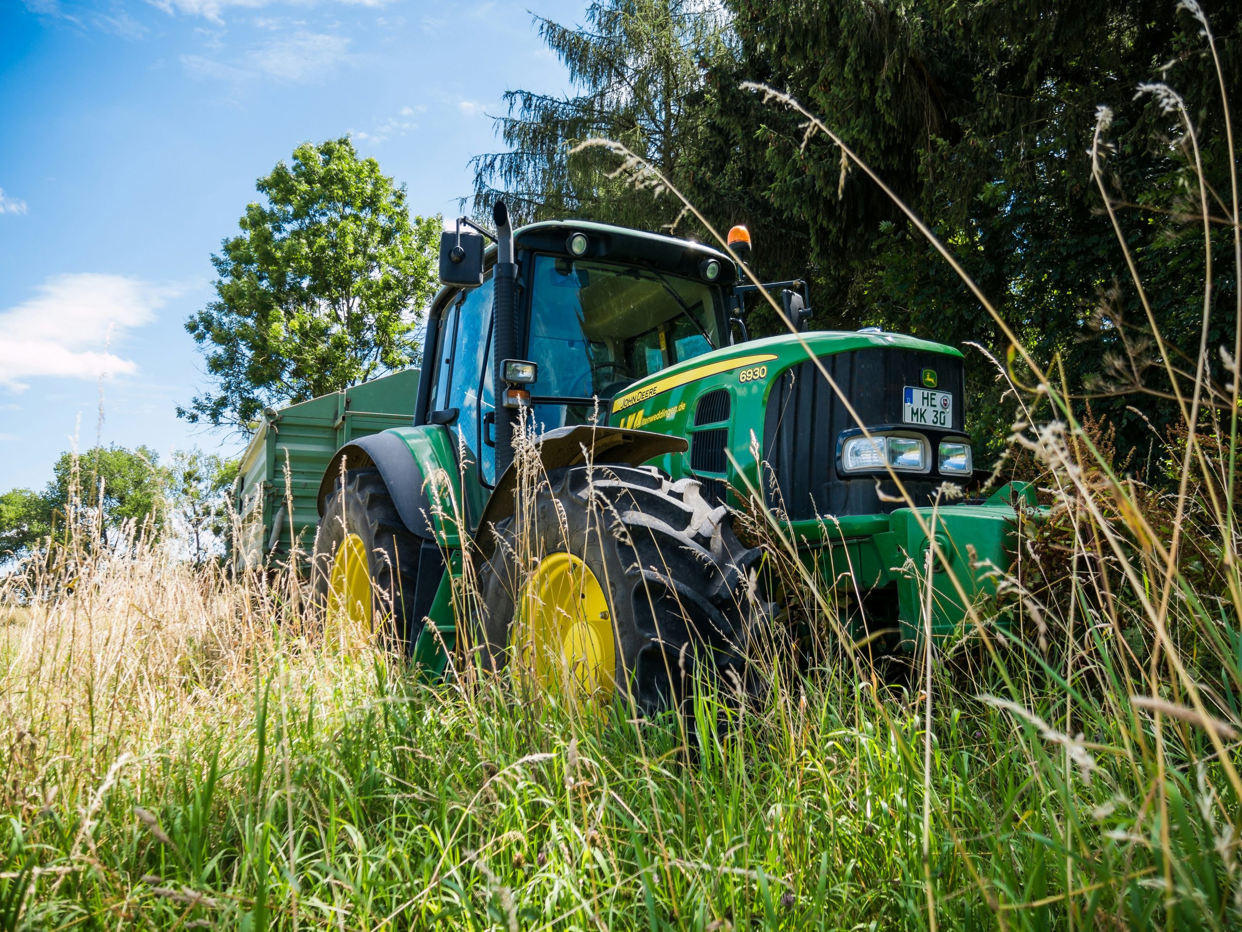 Agricultural Tractor (N601) – NPORS Accredited Course 2 Operator driving agricultural tractor during NPORS N601 training in field