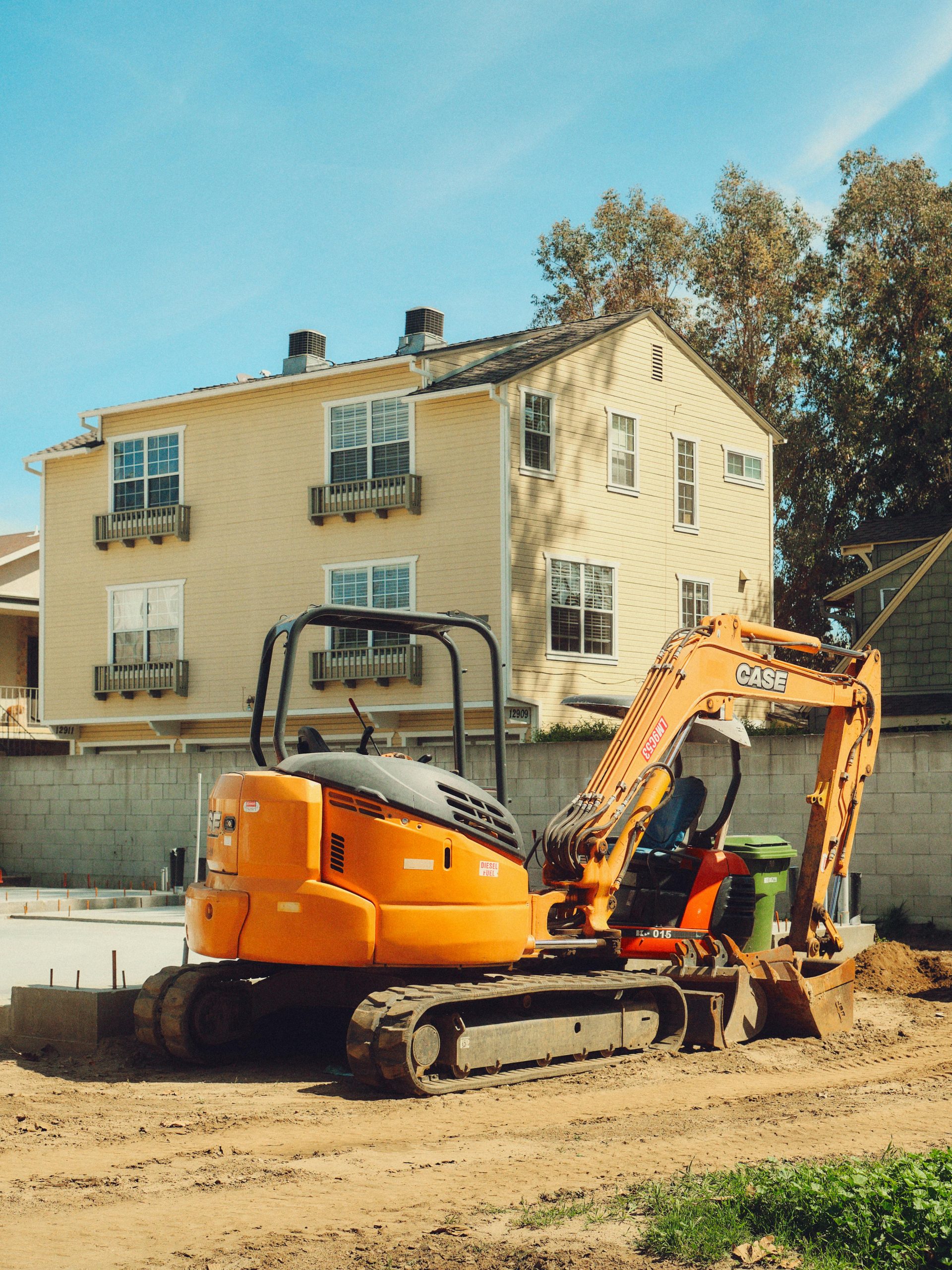 Trainee using micro excavator during NPORS N016 training on compact construction site
