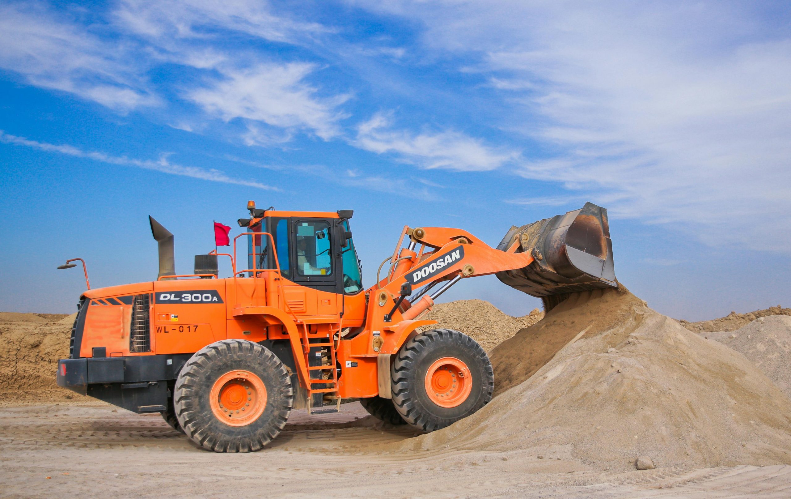 Operator skillfully operating loading shovel during NPORS N209 training on construction site