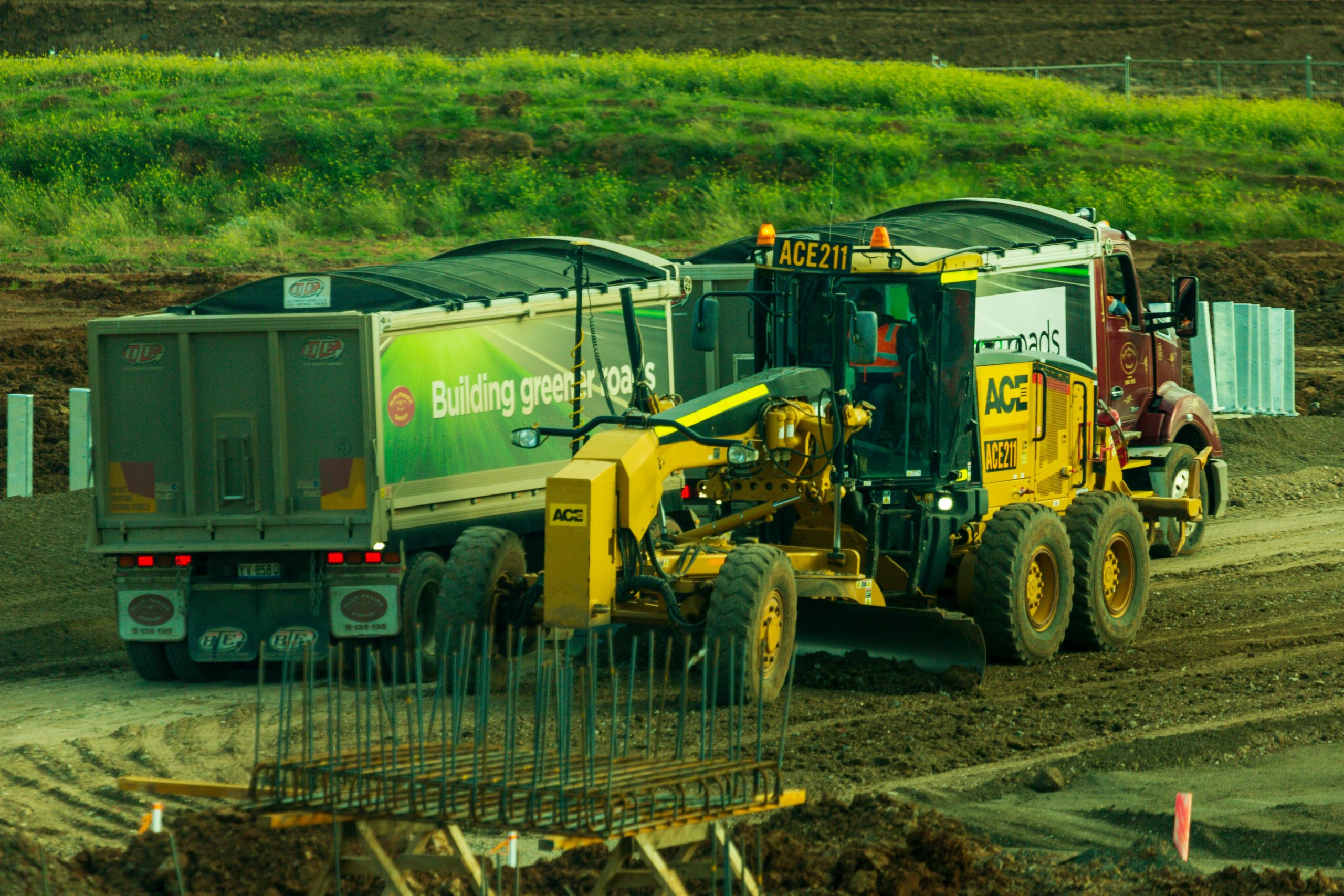Operator skillfully operating grader during NPORS N240 training on construction site