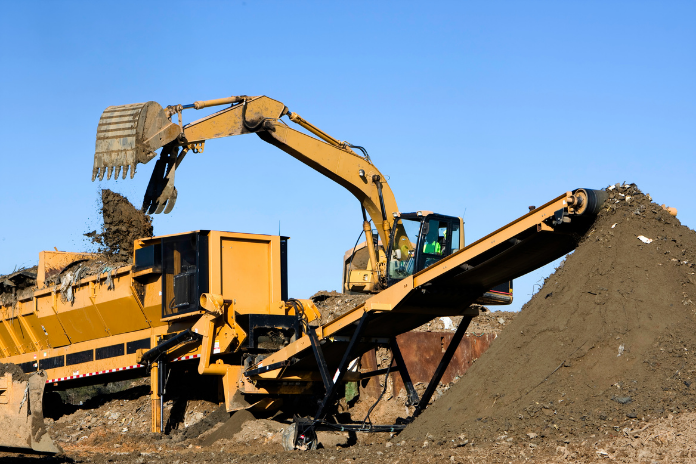 Operator expertly managing screener machine during NPORS N208 training on construction site