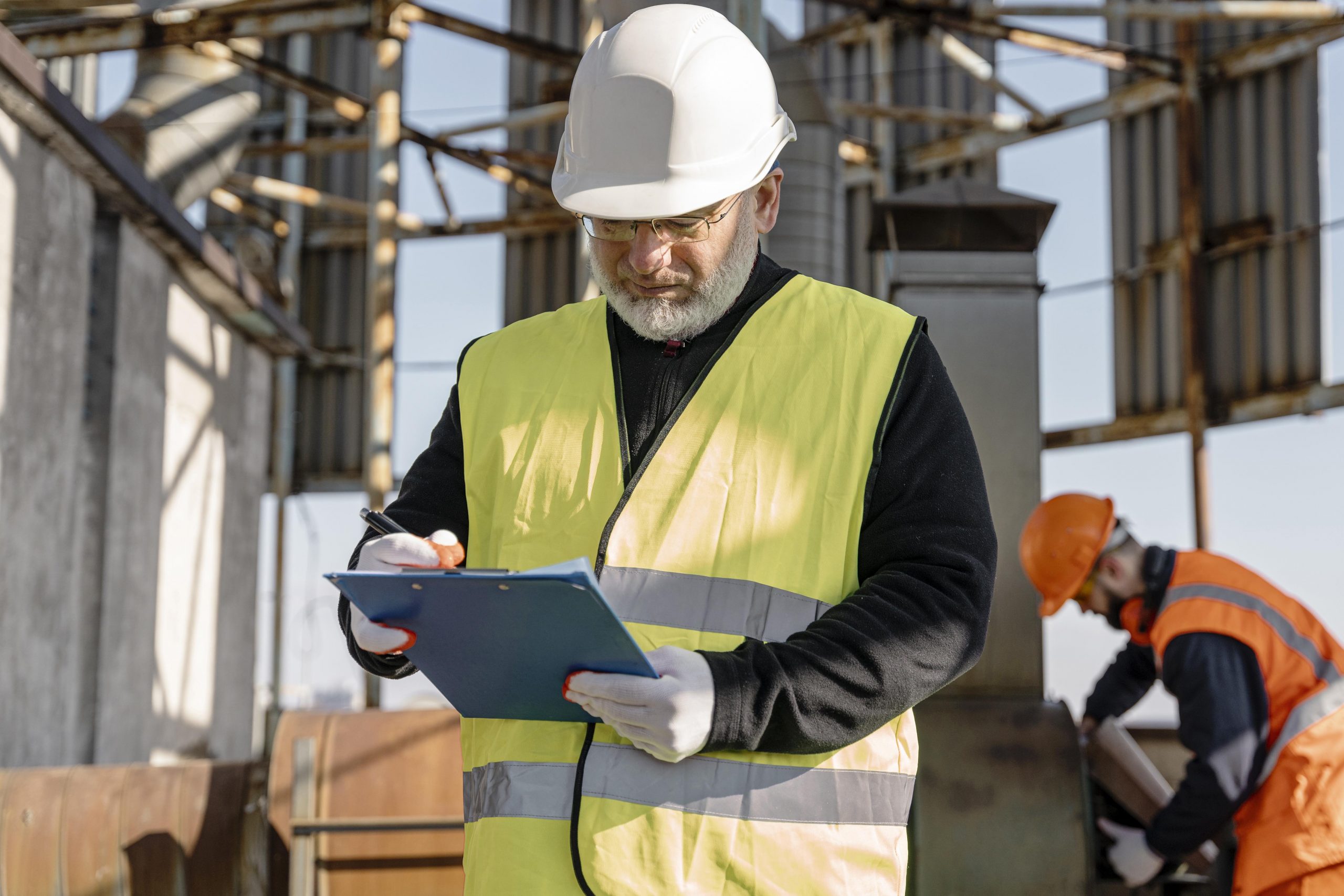 Construction site manager overseeing project works during NVQ Level 6 Site Management training