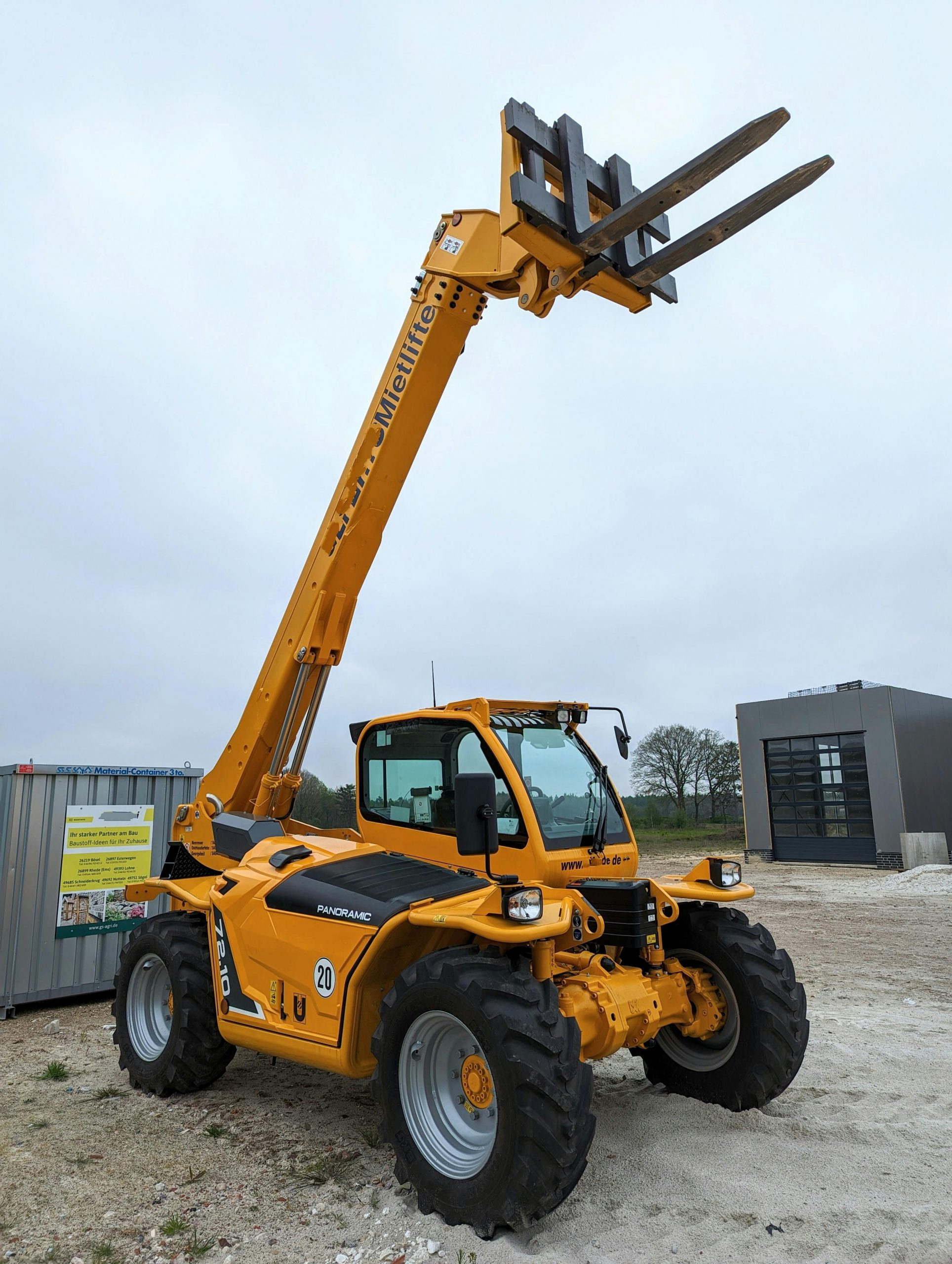 Operator using telescopic handler on construction site during NPORS N010 training course
